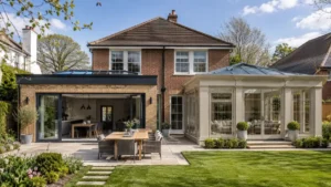 Extensions and Orangeries showcasing a modern home extension with a luxury glass orangery, spacious patio, landscaped garden, and open-plan living.